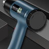 A close-up view of a dark gray electric heat gun with an adjustable handle and digital display, shown against a dark backgrou