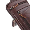 A close-up view of a dark brown vintage leather multi-pocket waist bag with zippered compartments.