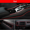 Close-up view of red flexible car interior trim strips and dashboard components.