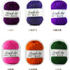 A collection of eight balls of purple, pink, orange, and green acrylic yarn labeled with corresponding numbers.