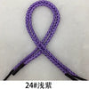 A purple braided string rope with black ends, shown in an 'X' shape.