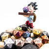 Anime character holding a metal polyhedral dice set with dragon font above a pile of dice.