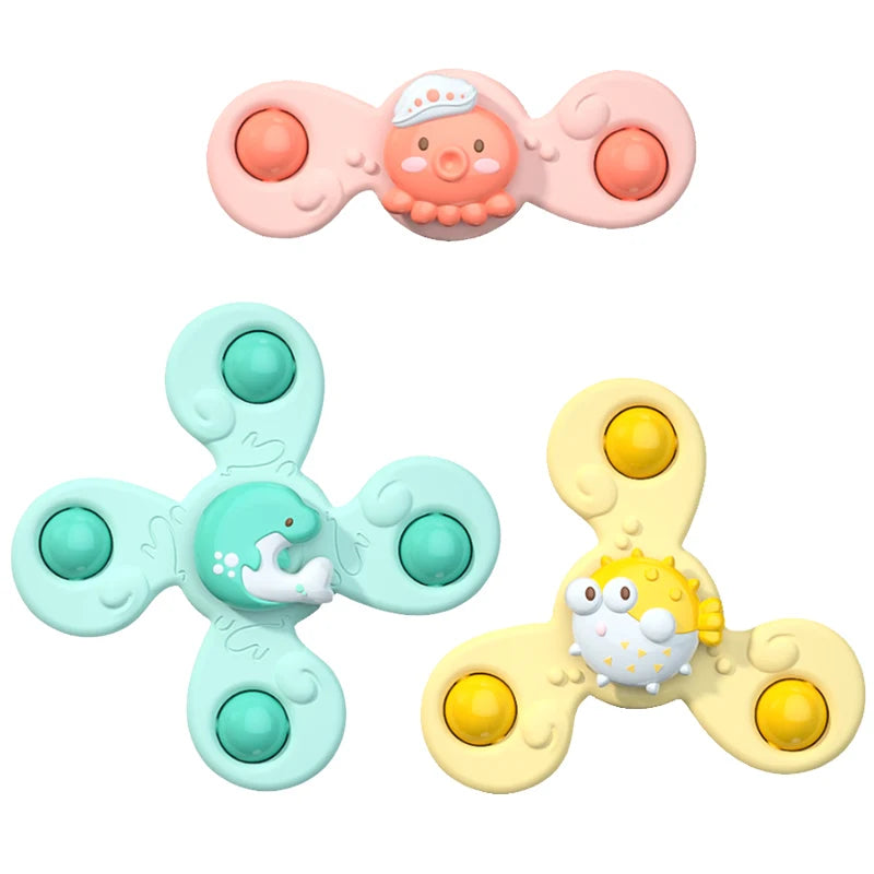 Two suction cup spinner bath toys for toddlers, one pink and one yellow.