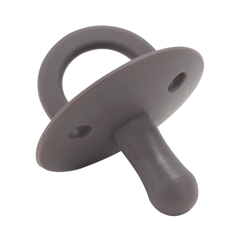 A gray silicone baby pacifier soother with a ring and a handle.