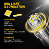 A close-up of a bright LED car bulb with a yellow light emitting from the lens.
