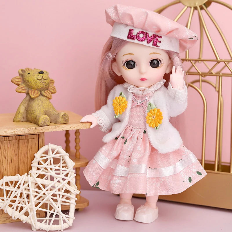 A pink fashion doll wearing a chef hat and white coat stands next to a golden cage and a wooden stand.