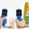 Hands hold a blue digital tester measuring water and oil, demonstrating engine oil measurement.