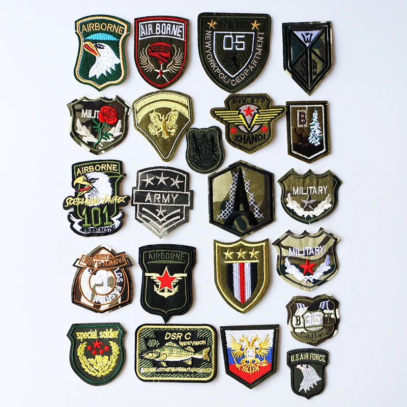 A collection of embroidered US Marine Corps medal patches featuring various military and service insignia.