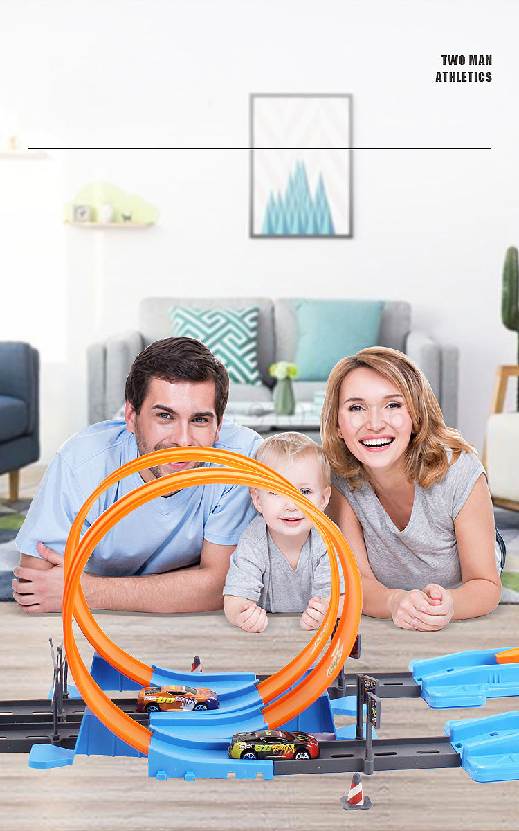 A family of three is pictured with a DIY stunt racing car track set featuring an orange loop and dual-lane races on a wooden 