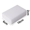 A rectangular white melamine cleaning sponge with dimensions 6cm by 10cm and a thickness of 2cm.