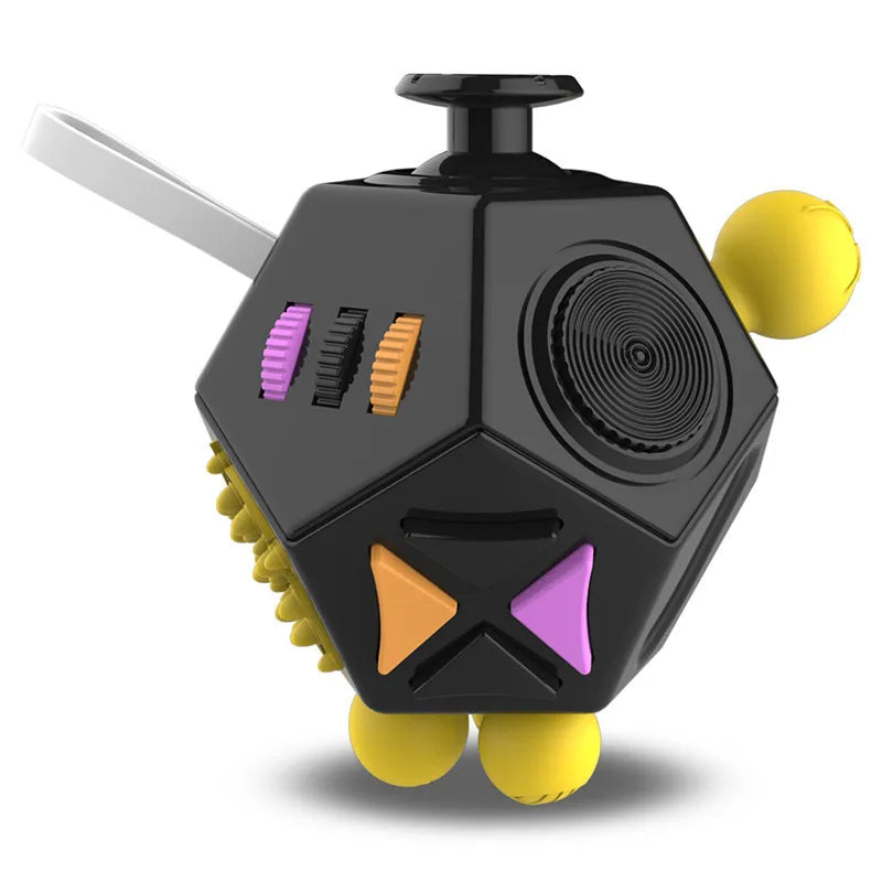 A black 12-sided fidget cube with a silver lever and yellow spherical pieces.