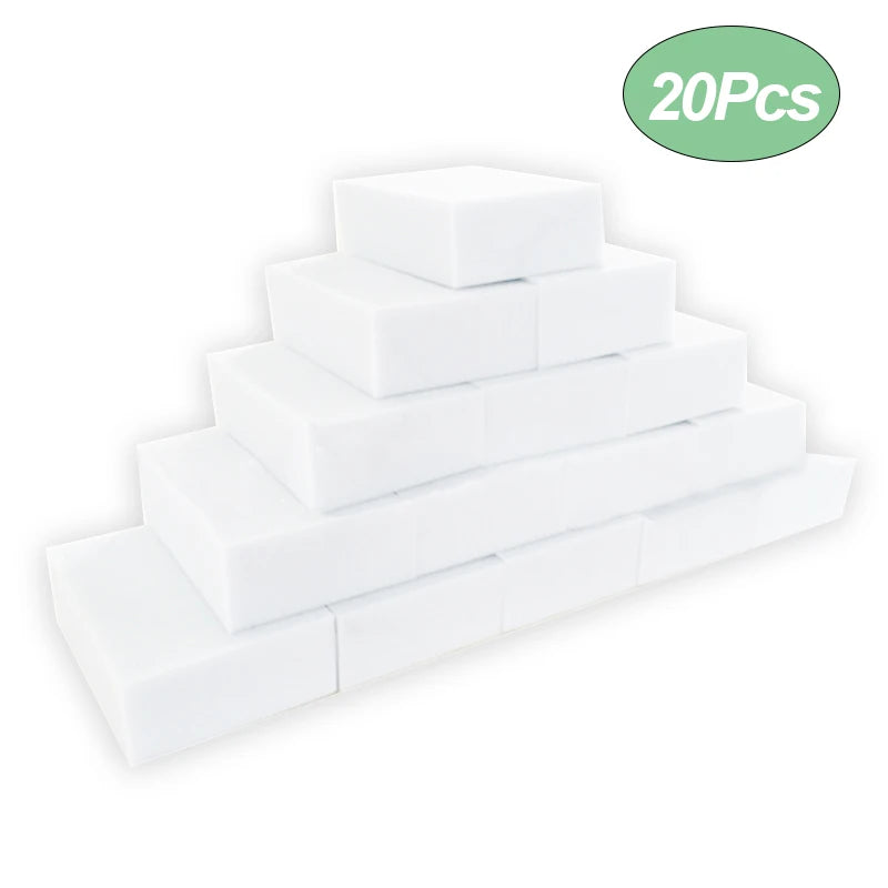 A stack of twenty white melamine cleaning sponges.