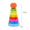 A stack of colorful wooden rings forming a tower puzzle for toddlers, with an orange top and blue base.