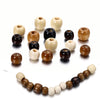 A collection of natural wooden spacer beads in various light and dark shades arranged in a circular pattern.