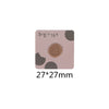 A square iron-on patch featuring a round, textured brown food item on a light pink background.