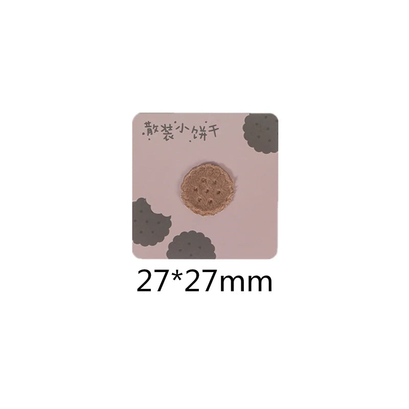 A square iron-on patch featuring a round, textured brown food item on a light pink background.