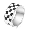 A silver chunky ring with a black and white checkerboard pattern.