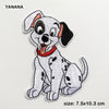 A white and black spotted dog embroidered patch with floppy ears and a red collar