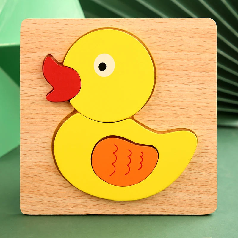 A wooden puzzle featuring a yellow duck with an orange beak and body, set in a light wood square.