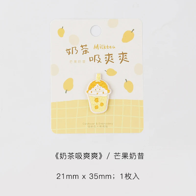 Yellow embroidered patch featuring a cupcake design and Chinese text for milk tea
