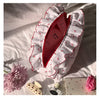 Neceser acolchado con estampado floral y lazo decorativo