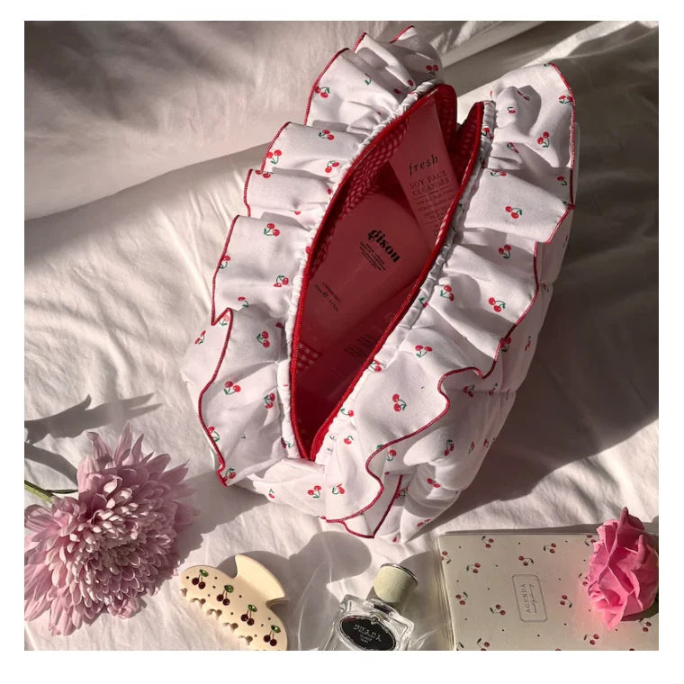 Neceser acolchado con estampado floral y lazo decorativo