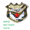 Embroidered military shield patch featuring a star and wings on a striped background