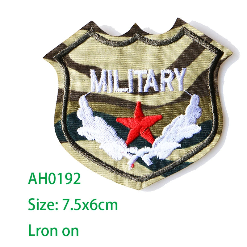 Embroidered military shield patch featuring a star and wings on a striped background