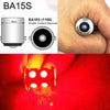 A close-up of a BA15S light bulb and its application in a vehicle's turn signal or reverse light.
