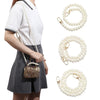 A woman models an elegant pearl chain strap for a handbag, showing the delicate jewelry and its use.