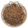 A small, ornate silver dish filled with a pile of mixed glass seed beads in various shades of brown and gold.