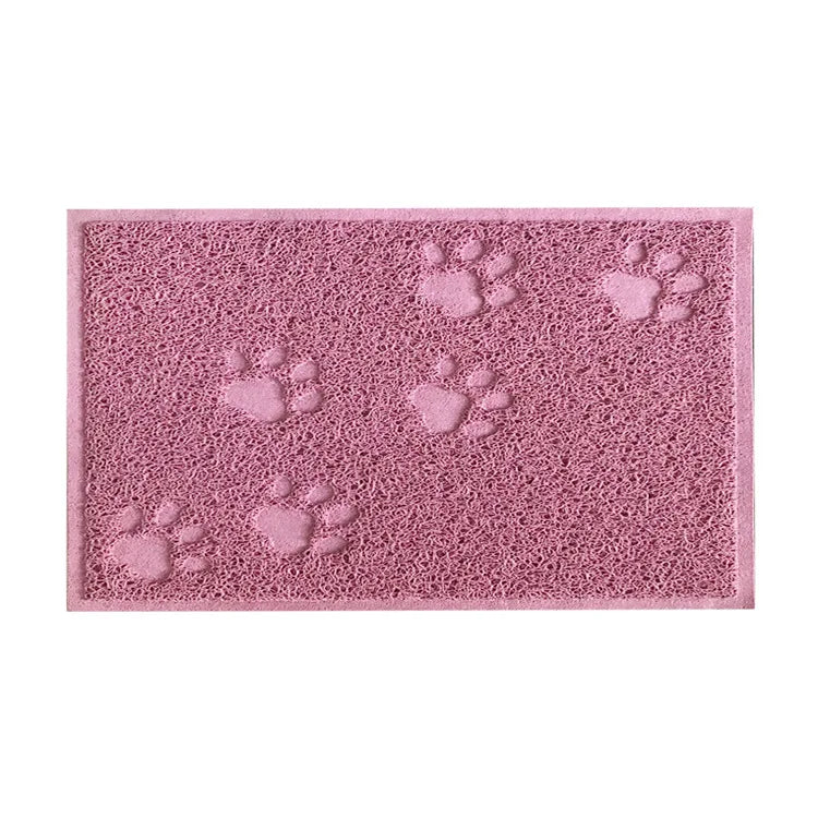 A pink cat litter mat with multiple paw print designs, made of waterproof non-slip PVC.