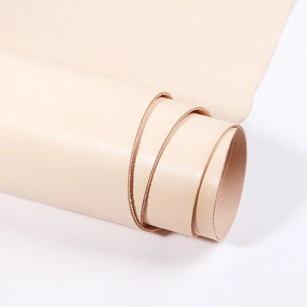 A roll of light beige vegetable-tanned full-grain leather used for crafting.