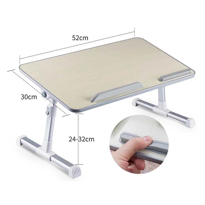 An adjustable foldable laptop desk with a light wood-colored surface and silver metal frame.
