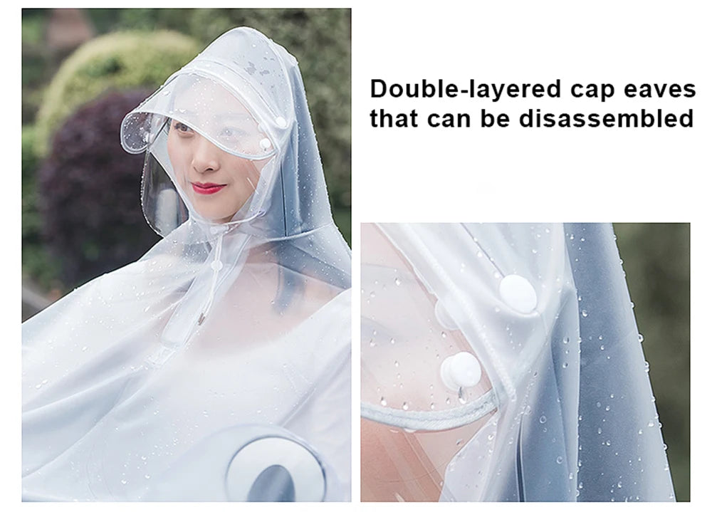 Double-layered transparent waterproof motorcycle rain poncho with a hood being worn.