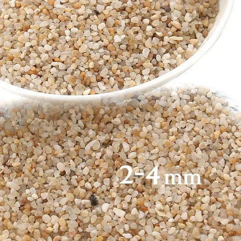 Close-up view of light beige decorative stone pebbles for terrariums and aquariums, showing granular texture.