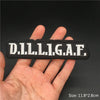 Black embroidered patch with the letters D.I.L.L.I.G.A.F. held in a hand.