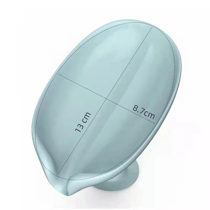 Light blue leaf-shaped suction cup soap dish with a self-draining tray and measurement markings.