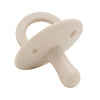 A beige silicone baby pacifier soother with a rounded handle and a smooth body.