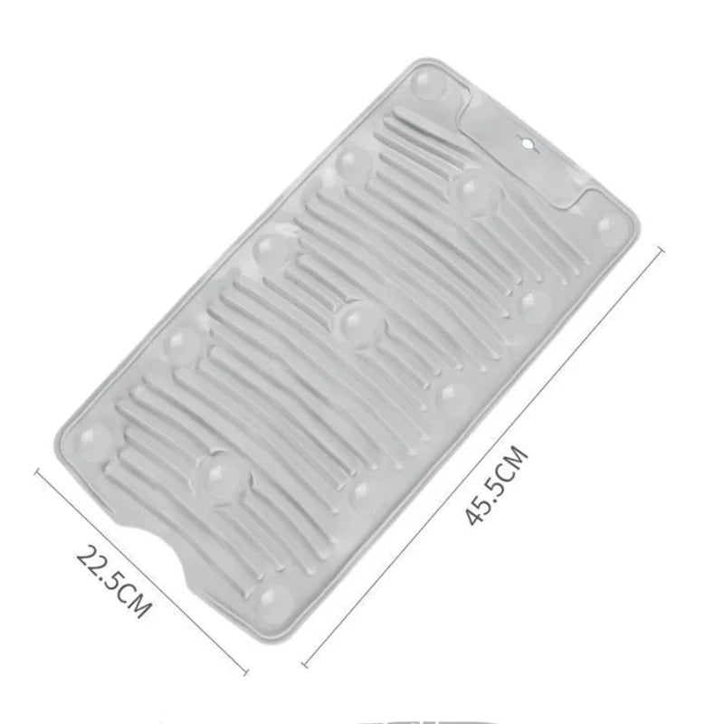 A clear silicone washboard with non-slip suction cups, shown from above.