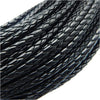 A close-up view of a spool of black braided leather cord for jewelry making.