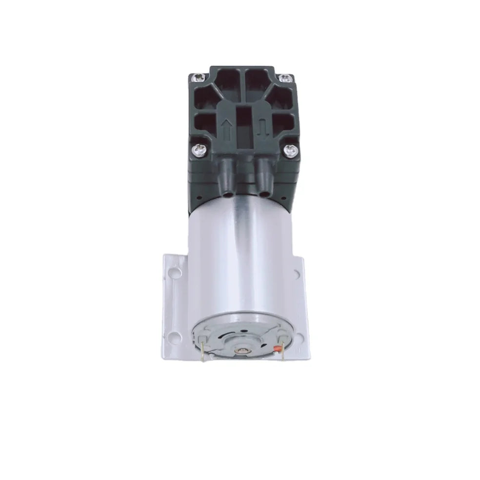 Una bomba de aire diafragma de 12V DC compacta con cuerpo cilíndrico plateado y ensamblaje superior negro.