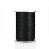 A spool of black waxed cotton cord for jewelry making