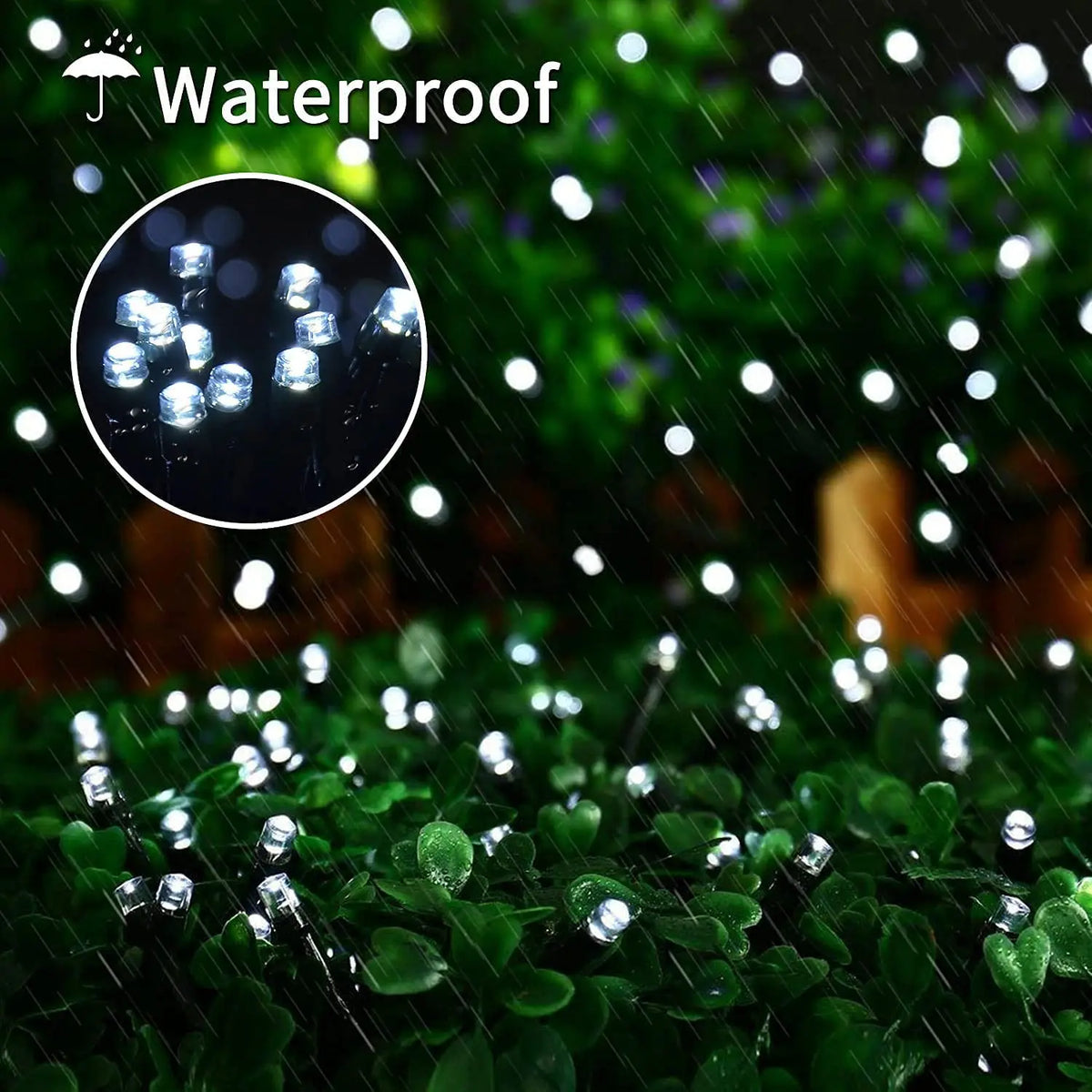 Close-up of waterproof garden string lights illuminating lush green foliage under a rain effect.