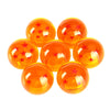 Five glossy orange shift knobs with a star design arranged in a pyramid formation.