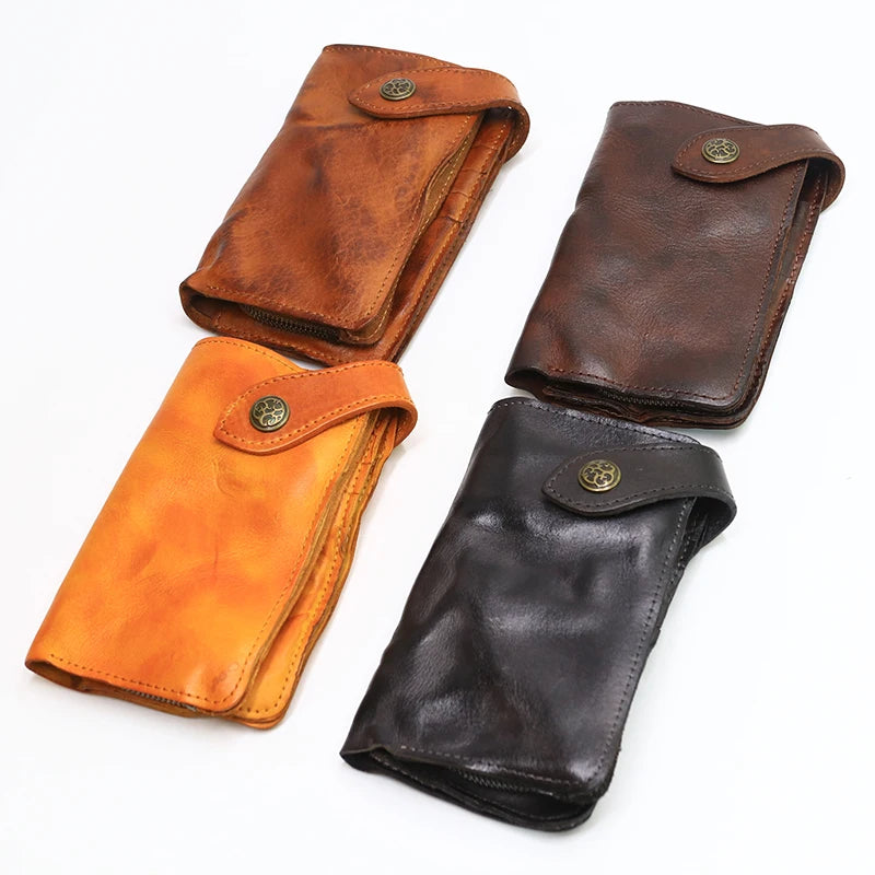 A set of three vintage brown and black cowhide leather bi-fold wallets.