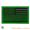 Embroidered American flag patch featuring green and black stripes and stars.