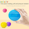 A hand is holding a bright blue silicone ball, surrounded by yellow and purple balls, demonstrating the molding ability of so