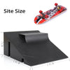 A black finger skateboard set with a red deck and a black park ramp, shown next to a size reference.