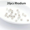 20 pieces of rhodium silicone rubber ear back stoppers with copper rings displayed on a white dish.